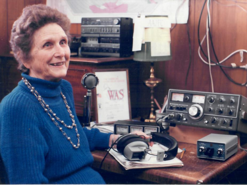 Vivian Pitzrick sitting at a desk with her radio equipment